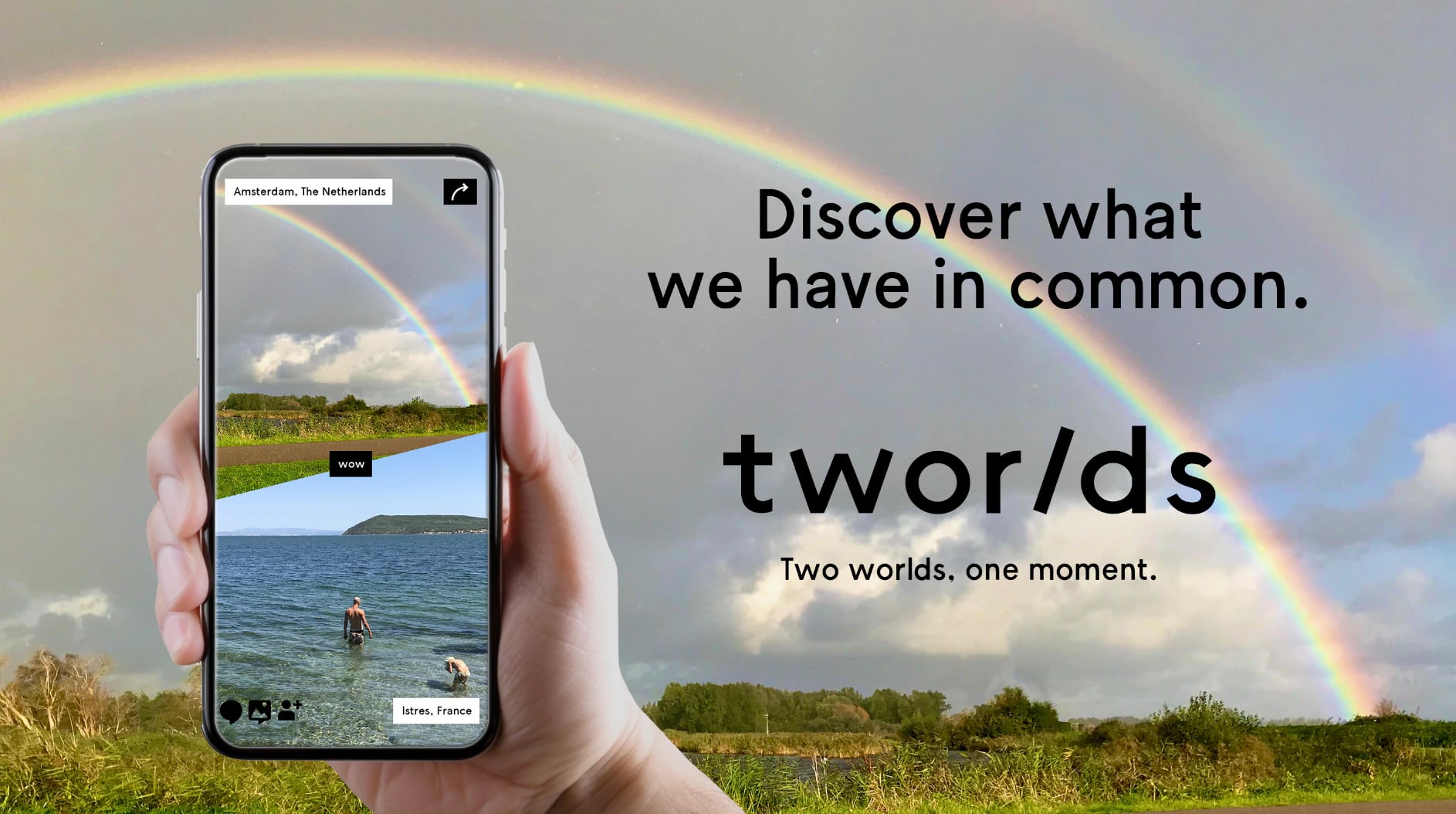 Hand holding a phone running Tworlds under a rainbow, next to the tagline: Discover what we have in common. Two worlds, one moment.